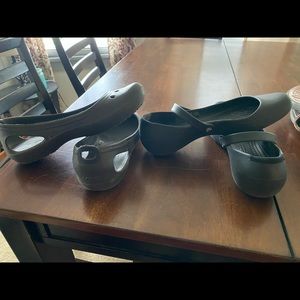 2 pair of crocs - one brown pair, one black pair